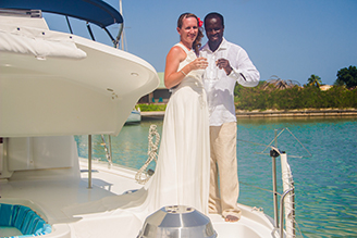 Married couple aboard a luxury Catamaran