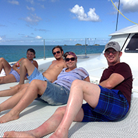 Friends relax on the catamaran